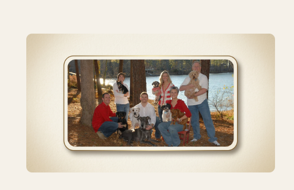 The Waggin' Wagon family with their dogs by the lake